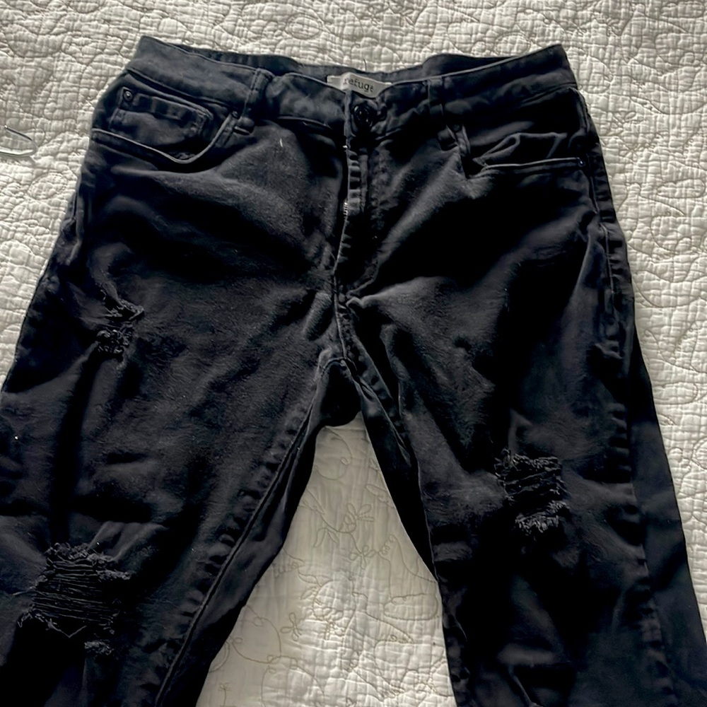 Ripped skinny black pants